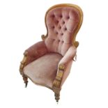 A large and comfortable mid-19th century mahogany show-wood-framed spoon-back chair; the faded red