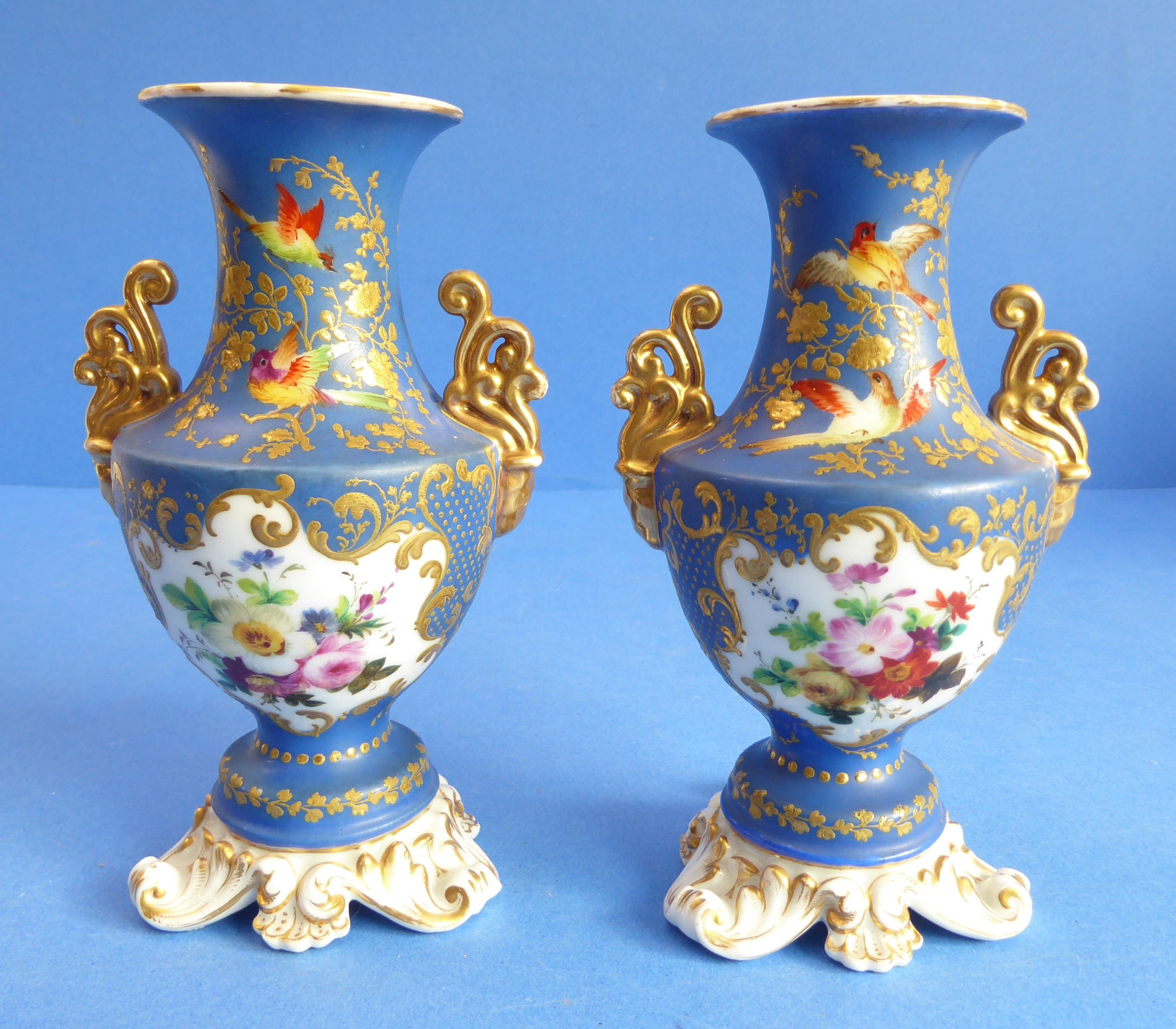 A pair of 19th century French porcelain vases: each with two gilt handles and vignettes of floral - Image 2 of 4