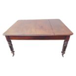 An early Victorian mahogany extending dining table: thumbnail moulded top above four lappet carved