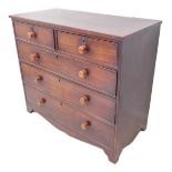 An early 19th century mahogany chest; two half-width over two full full-width graduated drawers,