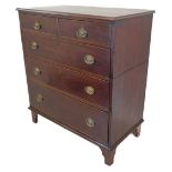 A George III period two-part mahogany chest: the rosewood crossbanded moulded top above two half-