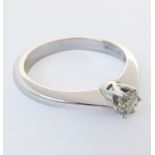 An 18-carat white gold solitaire diamond ring, ring size I/J