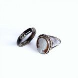 A silver, enamel and marcasite ring and a silver cameo ring, ring sizes L and M