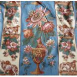 A pair of glazed cotton curtains in a blue/cream passionflower design; triple pinch pleat heading,