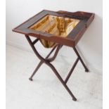 An Edwardian period mahogany and chequer-strung folding work table; the rectangular top opening to