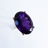 A 10-carat gold ring set with a large amethyst, ring size J/K (boxed)