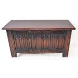A good reproduction oak chest in late 17th century style: carved arcaded top rail and panels
