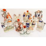 Nine 19th century hand-decorated flatback figures to include musicians, seafood sellers, a spill