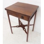 An unusual George III period foldover top mahogany centre table: single end drawer with dummy drawer