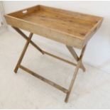 A large wooden two-handled tray on a folding base (85cm wide)