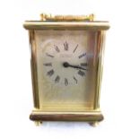 A 20th century gilt-metal carriage clock: the dial signed 'Martin & Co. - Cheltenham' and with Roman