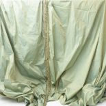 A pair of unlined curtains/hangings in green/gold shot silk, gathered heading, braid trim (approx.
