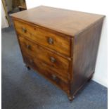 An early 19th century mahogany chest; three full-width graduated drawers raised on turned feet (93cm