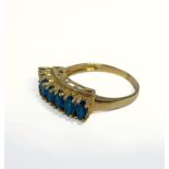 A 10-carat gold ring set with seven apatite stones, ring size O