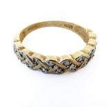 A 9-carat gold half eternity ring set with 18 diamonds, ring size O/P (two stones missing)