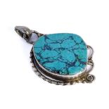 An unusual silver pendant of rope and scroll design centrally set with a polished turquoise stone