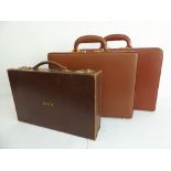 Two unused leather briefcases with 'Prestolock' gold-plated combination locks and fitted