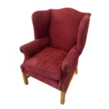 An early 18th century-style (reproduction) red suede upholstered armchair: shaped back, slightly