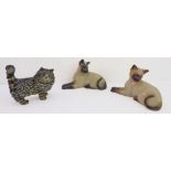 Two Beswick Siamese cats in recumbent position; each 1558, printed and impressed marks to underside,
