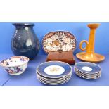 A selection of pottery and ceramics to include an oversized French orange-glaze pottery chamberstick