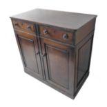 An early 19th century mahogany side cabinet; two half-width drawers retaining original locks and