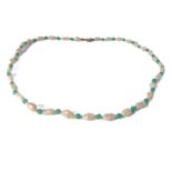 A pearl necklace, the pearls interspersed with green stone spheres, 9-carat yellow-gold clasp (