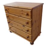 A modern pine four-drawer chest on bun feet (86.5cm wide x 44cm deep x 85cm high)