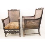 A pair of large and unusual heavy stained wood and rattan caned bergère chairs: each with carved