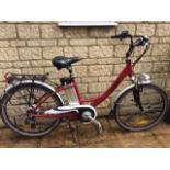 An 'E-Tourer' (Pro Rider) electric bike, with battery charger, red painted, four years old,