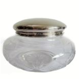 A circular cut-glass lady's dressing table jar: the hallmarked silver lid assayed Chester 1923,