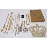 A selection of costume jewellery to include necklaces, brooches and earrings, and three lady's dress