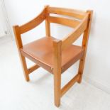 A Scandinavian-style stained-pine open armchair with tan leather seat (54.5cm)