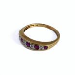 A 9-carat gold ring set with rubies and small diamonds, ring size P/Q (boxed)