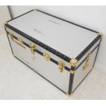 A silver-coloured metal-mounted storage trunk (97cm wide x 62cm deep x 56cm high)