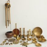 An assortment of mostly late 19th / early 20th century metalware to include candlesticks, a brass