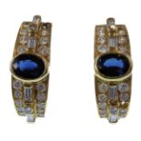 A pair of sapphire and diamond-set earrings, each C-scroll set with brilliant-cut (one deficient)