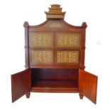 A large heavy and unusual hardwood side cabinet: Chinese-style pagoda top above two horizontal
