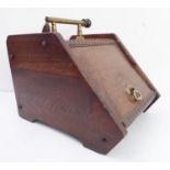 A late 19th century walnut coal box together with shovel in Aesthetic style