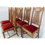 A set of six early 20th century oak chairs in Arts and Crafts/Art Nouveau style: pierced splats,