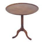 A fine quality Georgian style circular dish-topped occasional wine table: barleytwist stem and on