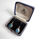 A pair of lady's boxed teardrop-shaped silver earrings: each mounted with a hand-cut aquamarine-