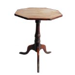 A late 18th/19th century octagonal vernacular oak occasional table: turned stem and tripod base (