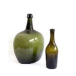 A large and unusual 19th century green-glass bottle (probably for spirits) of squat ovoid form
