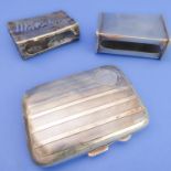 A silver cigarette case and two matchbox-holders: the early 20th century hallmarked silver kidney-