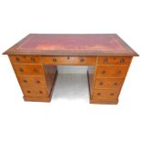 A 19th mahogany one-piece pedestal desk: the gilt-tooled leather insert moulded top above an