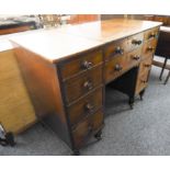 An unusual early 19th century mahogany desk; the central square section with cleating sliding