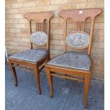 A pair of early 20th century light oak and upholstered Arts & Crafts/Art Nouveau side chairs: each