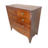 An early 19th century mahogany chest: two half-width over three full-width graduated drawers,