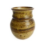 A glazed studio pottery vase of ovoid form (possibly Winchcombe ?): monogrammed stamp lower unglazed