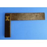 A 19th century rosewood handled and brass mounted set square (36cm)
